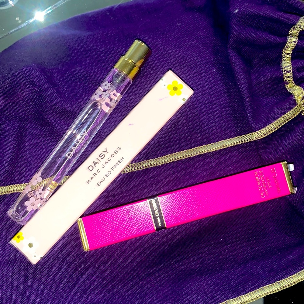 Two purse sized perfumes full never used